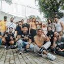 Diverse group of friends having fun and posing for a group photo outdoors in São Paulo.